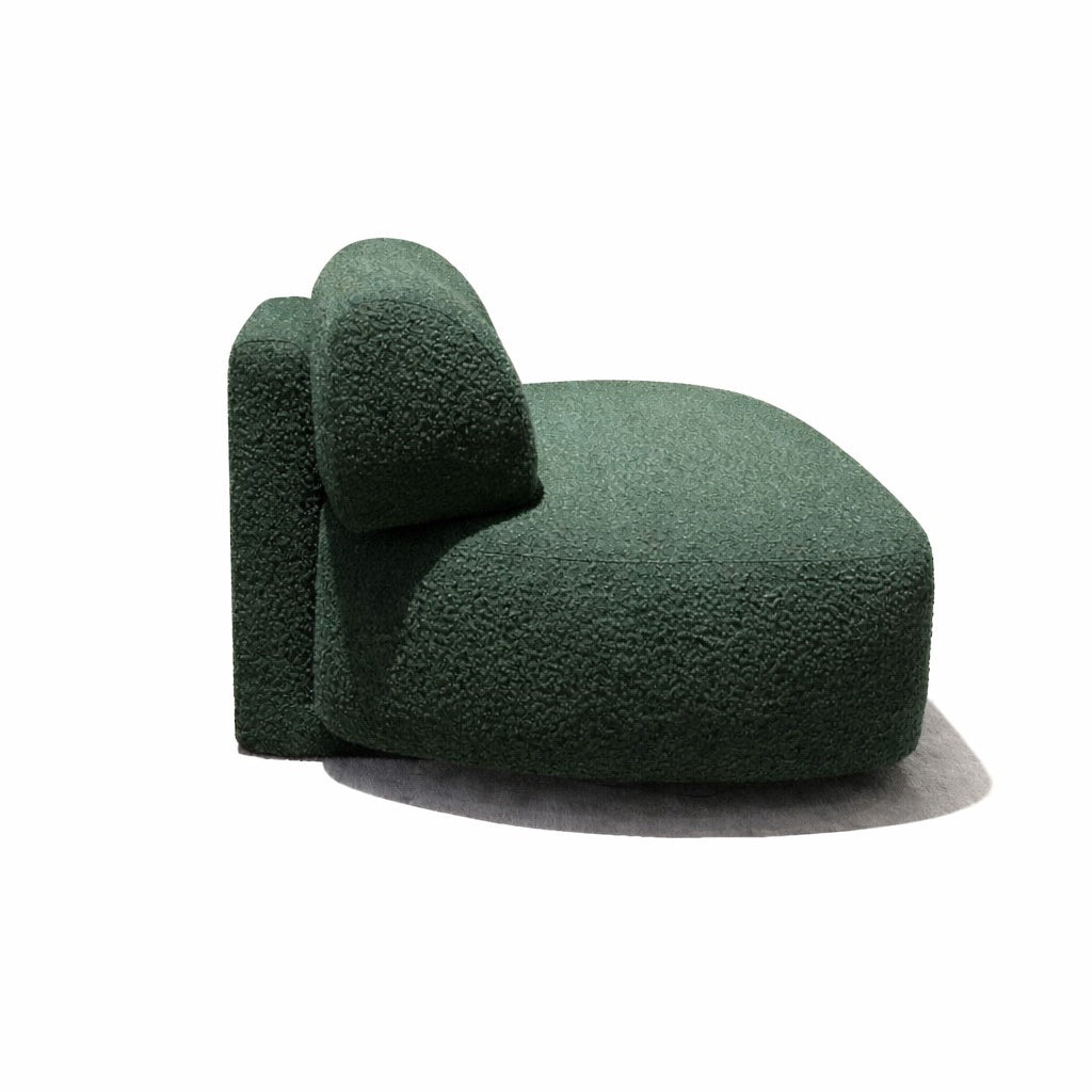 Green textured footstool on a white background