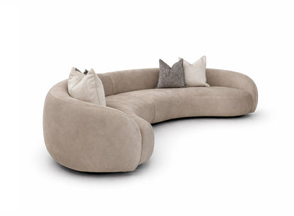 Beige curved sofa with decorative pillows a designer preference sofa