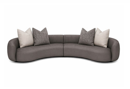 Gray suede curved sectional sofa with decorative pillows architectural interiors