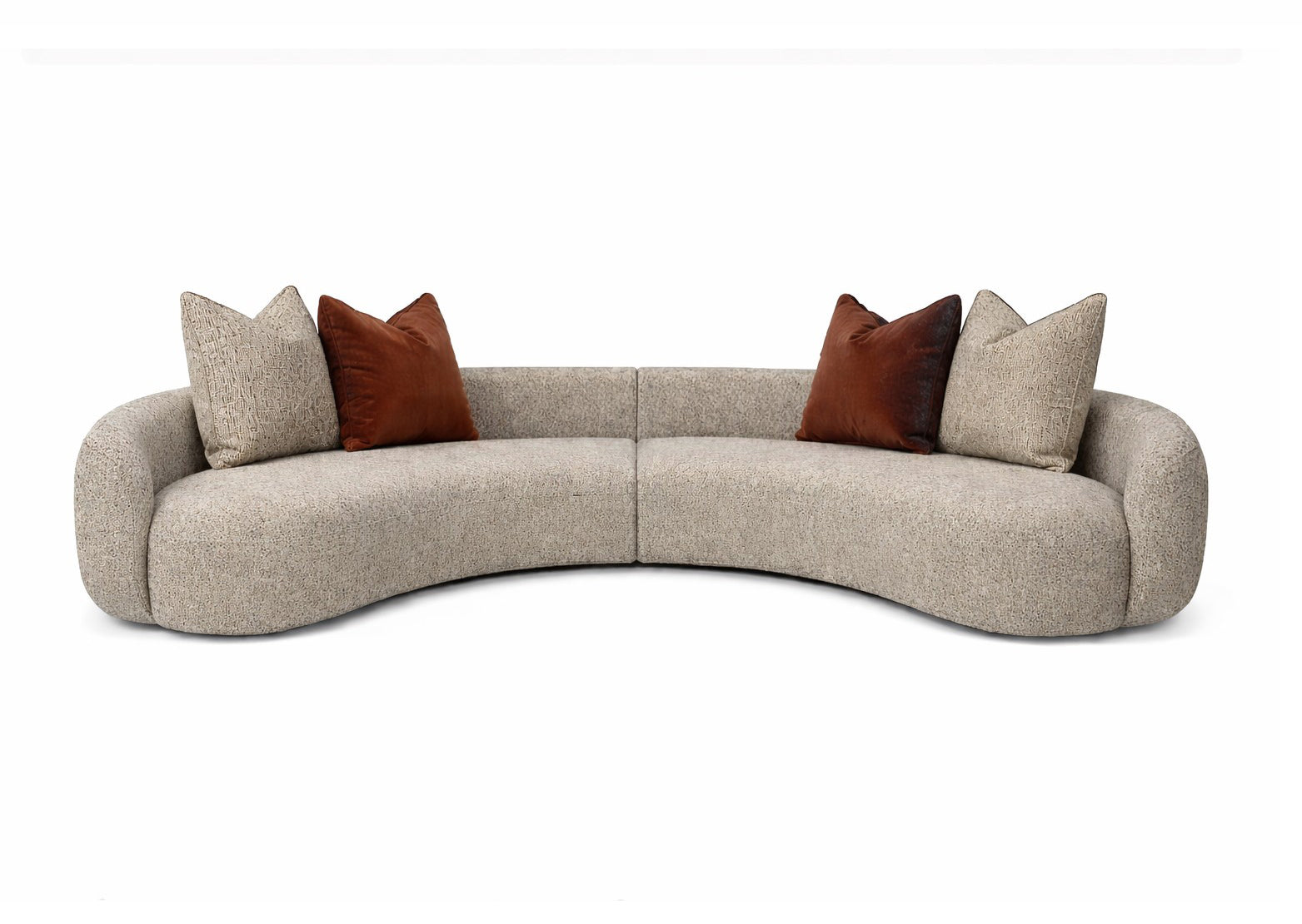 Curved beige sofa with brown and red cushions Miami store interior designer 