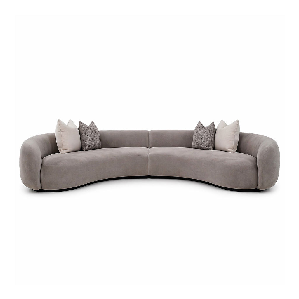 Taupe-Gray circular sofa with cushions for a contemporary living room setting