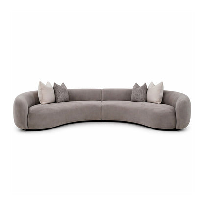 Taupe-Gray circular sofa with cushions for a contemporary living room setting