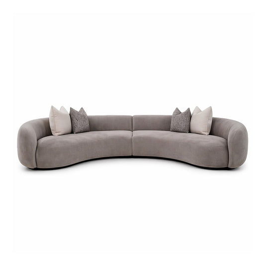 Taupe-Gray circular sofa with cushions for a contemporary living room setting