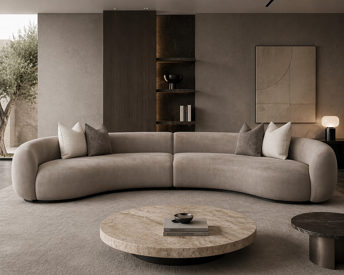Modern living room with a curved beige sofa, round coffee table, and decorative elements Miami luxury sofas